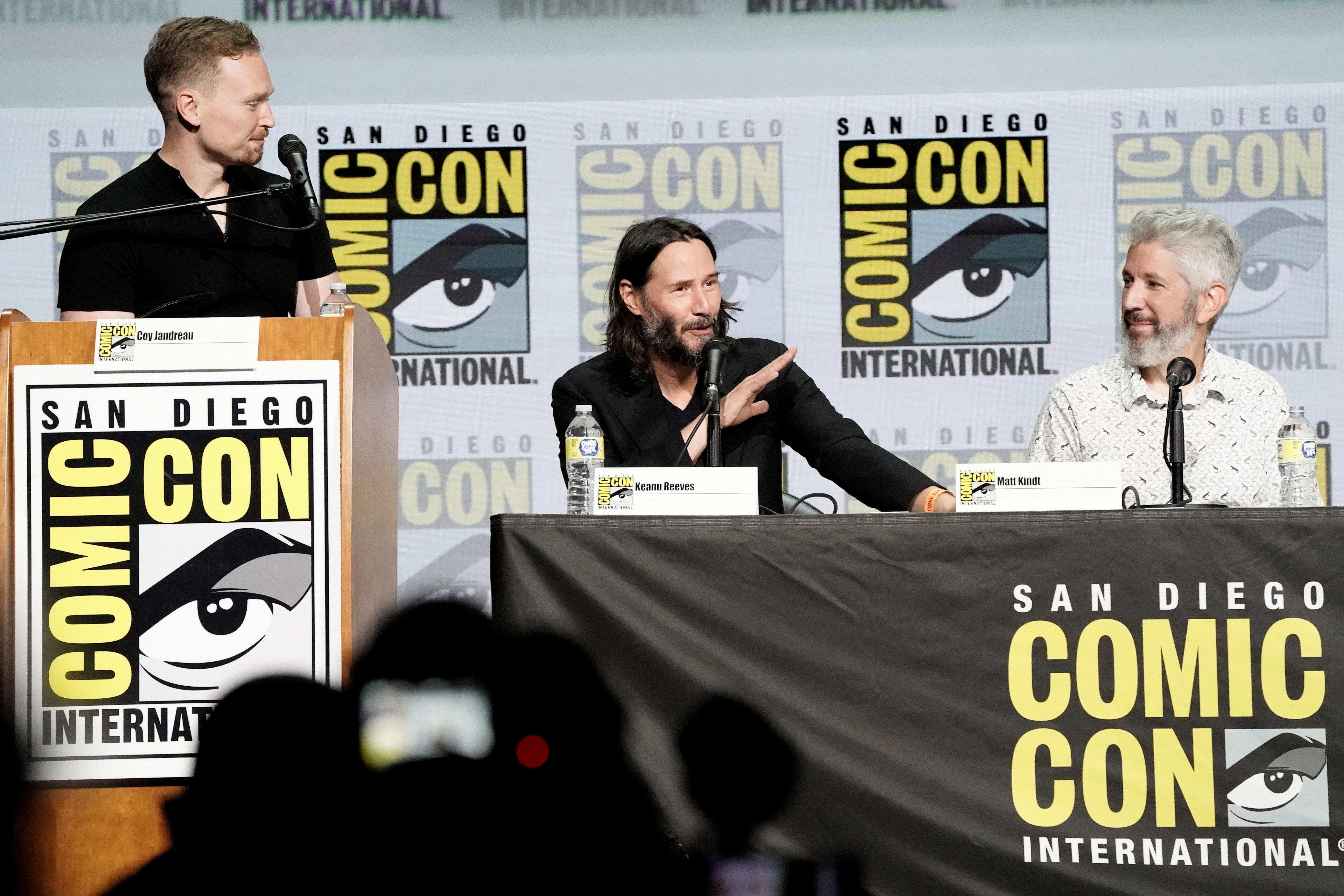 Keanu Reeves speaks during a panel about his comic book series, BRZRKR, with moderator Coy Jandreau and co-creator Matt Kindt (right) at Comic-Con International in San Diego, California, US, July 22, 2022. REUTERS/Bing Guan