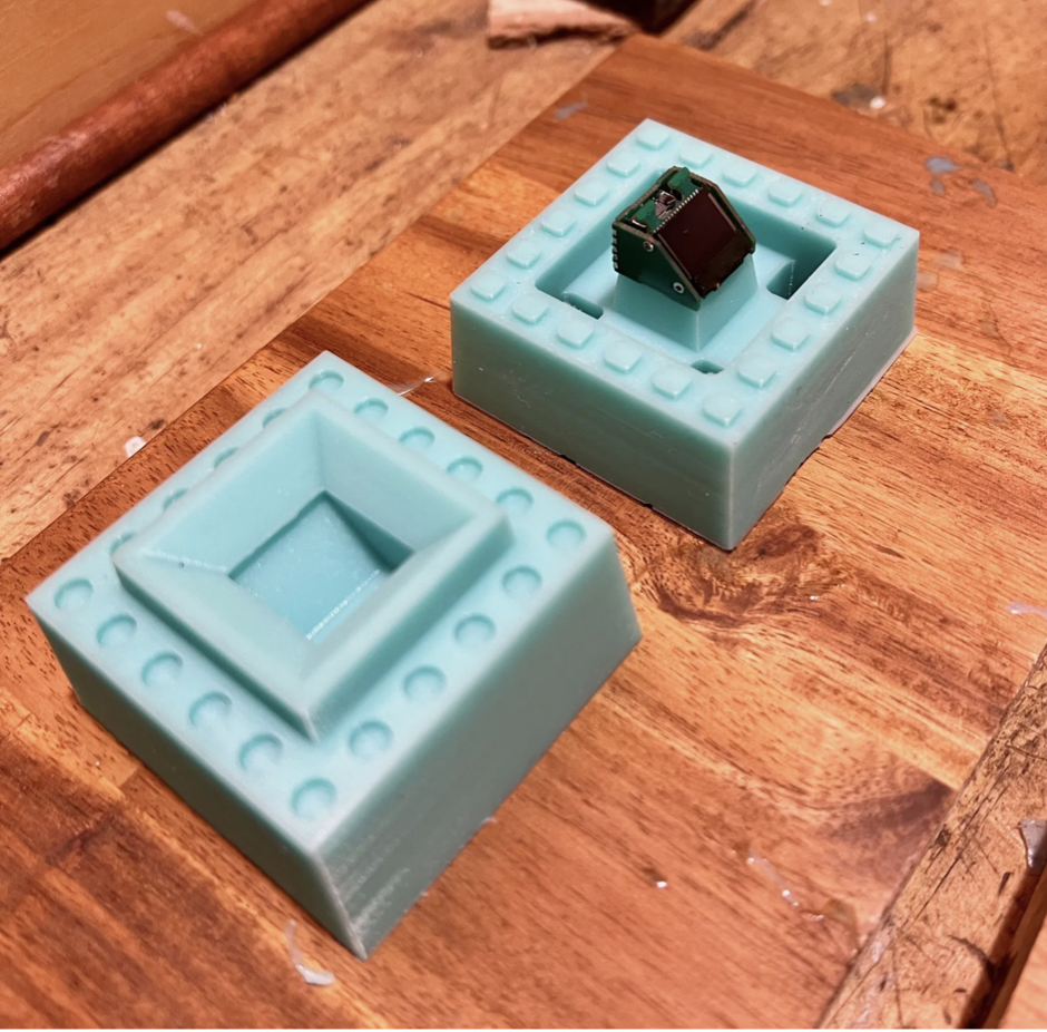 Brown now has a 3D printed template as part of his mold.  It allows you to pour resin to form the brick computer without first filling the brick cavity with silicone.  (Photo: James Brown)