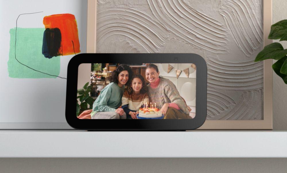 An Amazon Echo smart speaker with a screen showing photos