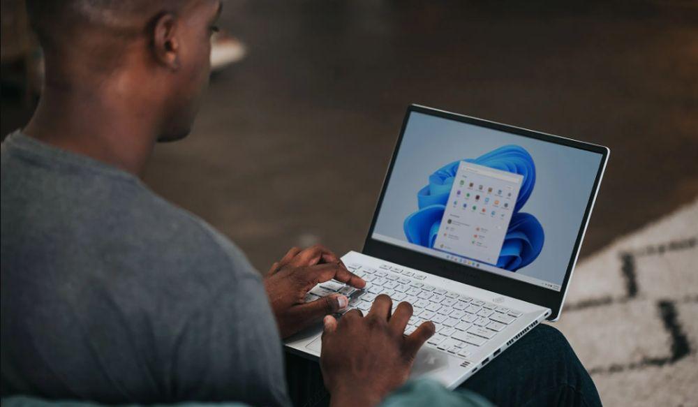 A Windows 11 user using their laptop
