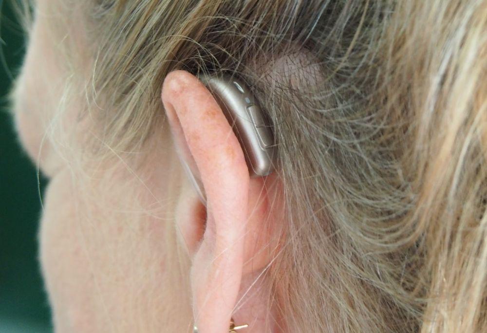 Hearing aid in one ear